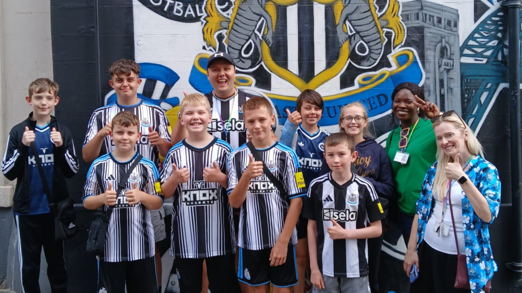 young carers enjoying a trip to watch a newcastle united football match,